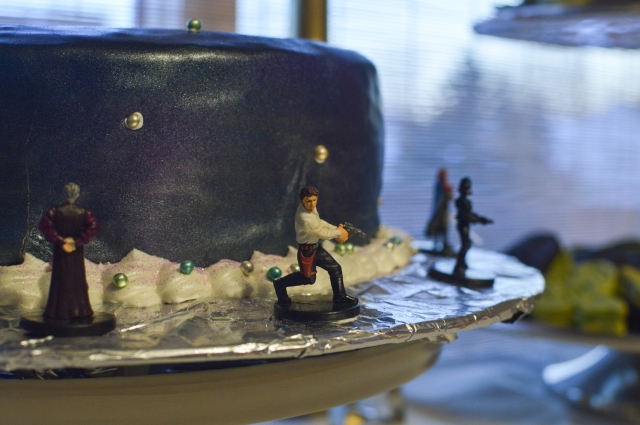 Galaxy cake with Star Wars miniatures.